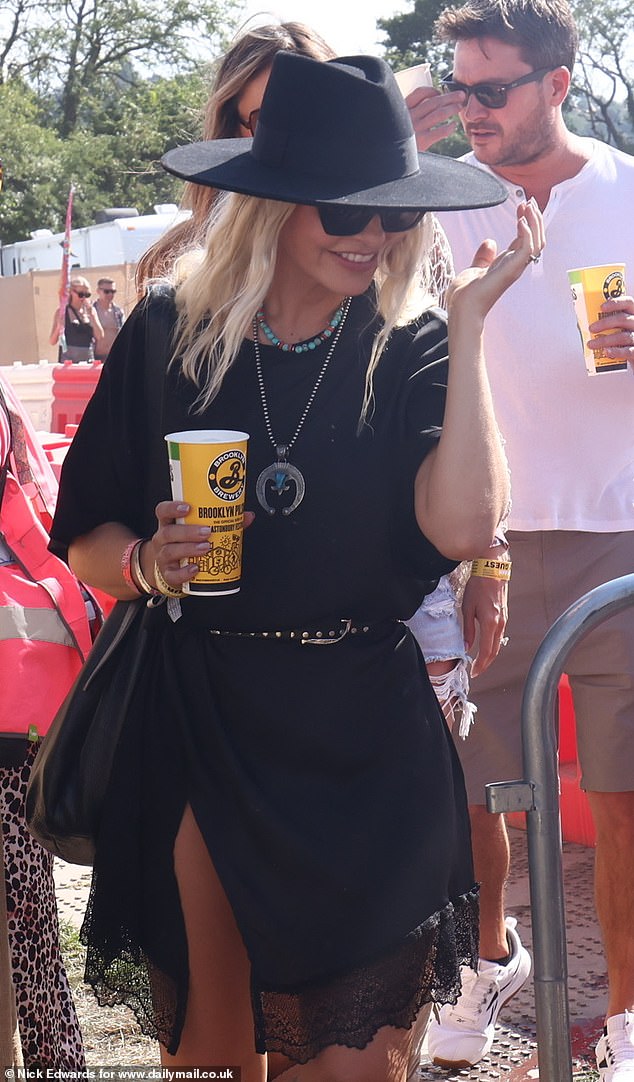 Holly sipped her drink as she soaked up the sunshine
