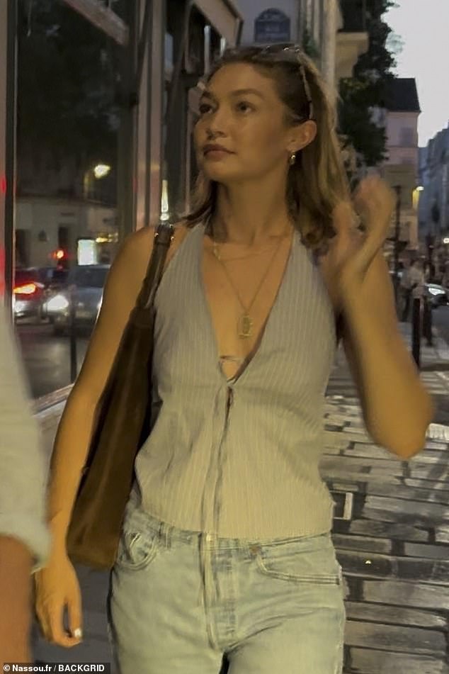 Arrested Development star Gigi, 30, showed off her slim physique in a stunning light blue pinstriped sleeveless halter-style top that featured a plunging neckline