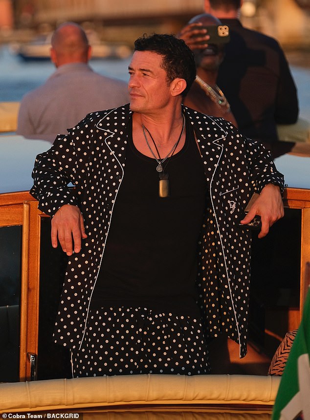 The newest bachelor in Hollywood looked relaxed as he lounged on a boat in Venice just shortly after it was revealed that he and his fiancée Katy Perry had called it quits after nine years together