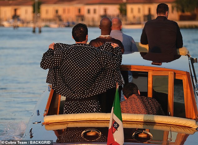 He left the black-and-white sleep shirt unbuttoned to reveal black tank top and several pendant necklaces on his neck, sporting matching Dolce & Gabbana polkadot PJs