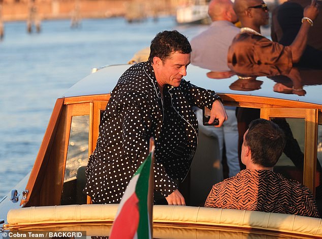 He left his hair purposefully tousled and looked calm and stoic as he leaned back as he and several pals traveled via water taxi to the next celebrity congregation spot in the city