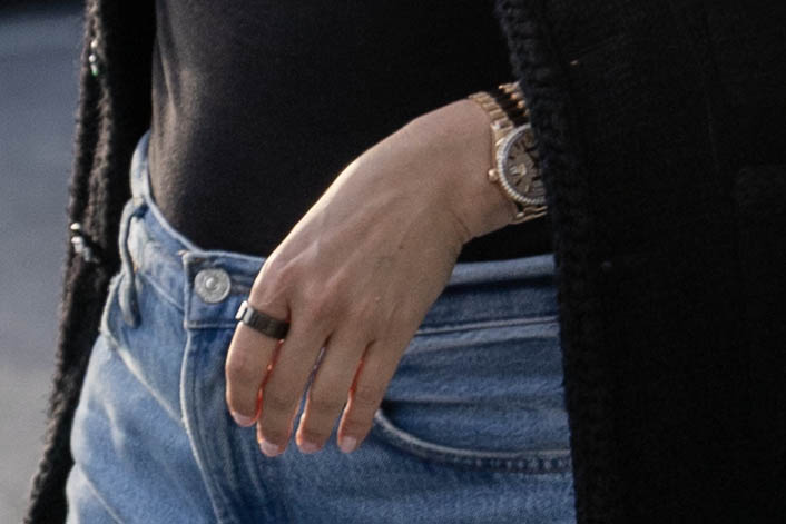 Close-up of Holly Valance's hand, showing a ring and watch.
