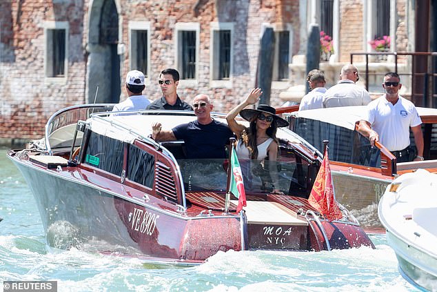 The loved up couple were seen waving as their boat pulled away from the Aman Venice hotel in the Italian hotspot