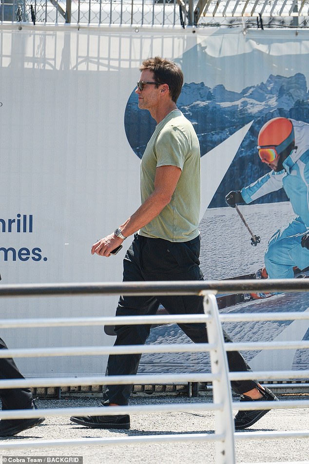 NFL legend Tom appeared to make his exit at the same time, looking relaxed in a green T-shirt and black cargo pants