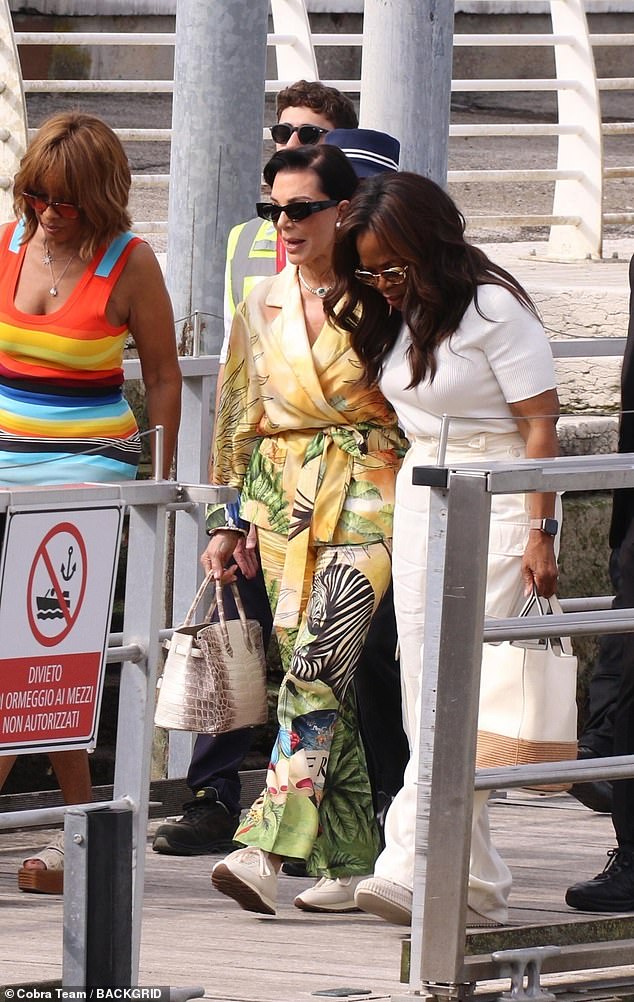 The Kardashian family matriarch looked in high spirits, wearing a jungle-patterned jacket and trouser co-ord and hiding behind black shades