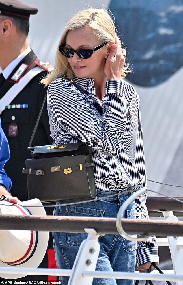 Sarah also looked effortlessly chic as she jetted into Venice Airport on Thursday. She was seen arriving in jeans, a button shirt while carrying a $54,000 Hermes Kelly bag on her shoulder