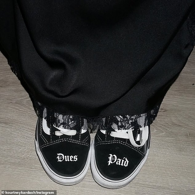 Complementing her husband's punk rock style, she wore a black leather jacket with the revealing dress and a pair of customized Vans sneakers. She also shared a snapshot showing that the toes of her shoes read 'Dues Paid' while there were barbed wire details along the sides of the platform