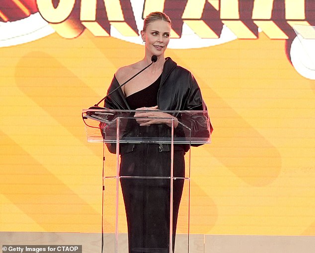 Charlize Theron eviscerated Bezos and Sanchez's wedding extravaganza at her charity event Block Party on Saturday night (pictured hosting the event)