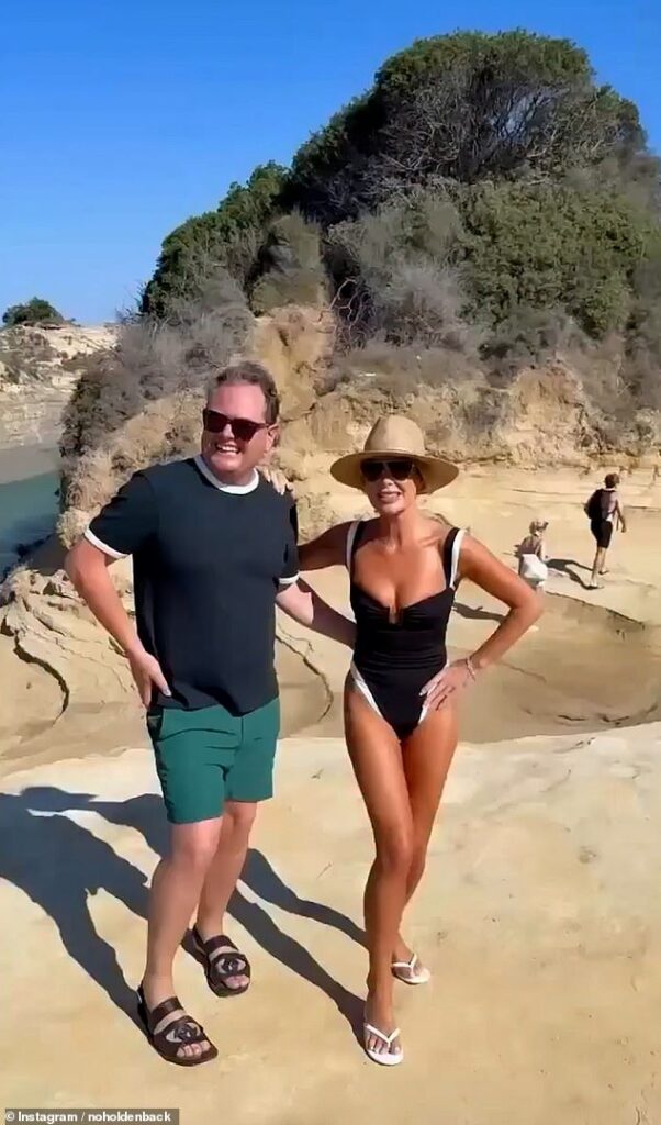 Amanda Holden showcased her sensational figure in a plunging swimsuit on Sunday as she enjoyed her time in Greece with Alan Carr