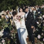 Blushing bride Daisy Lowe cradled her daughter Ivy as she walked down the aisle with new husband Jordan Saul in striking new wedding snaps