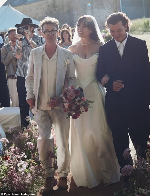 Daisy previously gave fans an insight into her idyllic Somerset wedding (pictured with stepfather Danny Goffey and father Gavin Rossdale)
