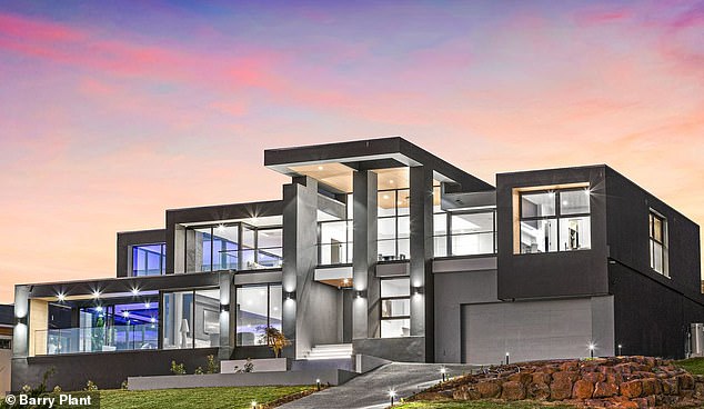Located in leafy Lysterfield, 32km from Melbourne , the five-bedroom, five-bathroom ultra-modern pad has a price guide of $6,500,000 to $7,150,000