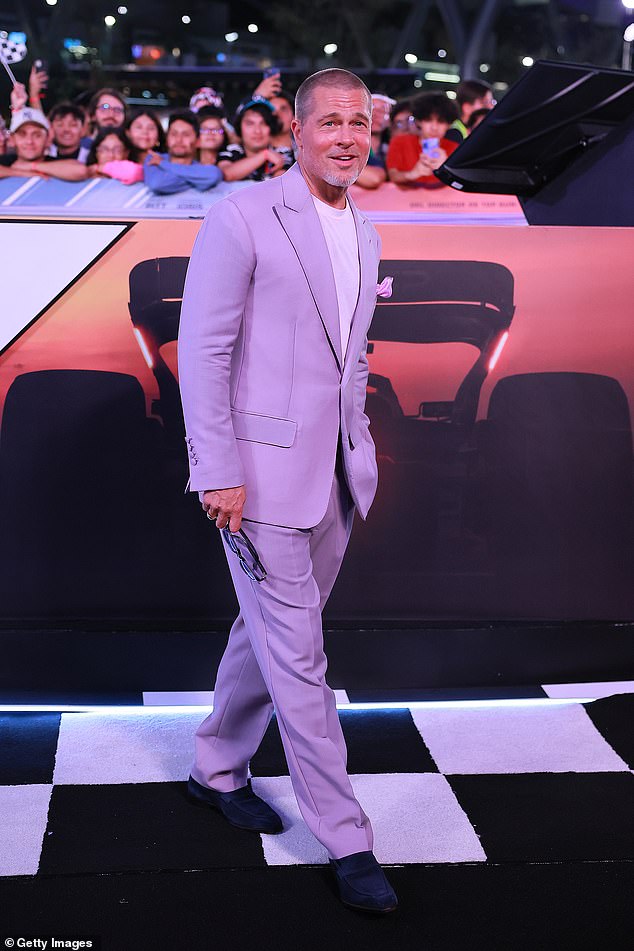 Brad Pitt, 61, looked typically dapper in an eye-catching suit as he stepped out to promote his new F1 movie in Mexico City