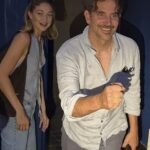 Gigi Hadid and Bradley Cooper were all smiles as they stopped for fans on their way home after a night out in Paris on Saturday