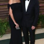 Bruce Willis ’ wife Emma Heming is opening up for the first time about how the action legend continued working on film sets even as his health quietly declined behind the scenes; (Bruce and Emma in 2014)