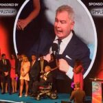 Eamonn Holmes faced a chorus of boos as he accepted the accolade for GB News at the TRIC Awards in his wheelchair on Tuesday evening