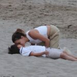 Eva Longoria looked every inch the doting mother as she spent quality time with her son, Santiago Enrique Bastón, during a beach outing in Marbella on Monday