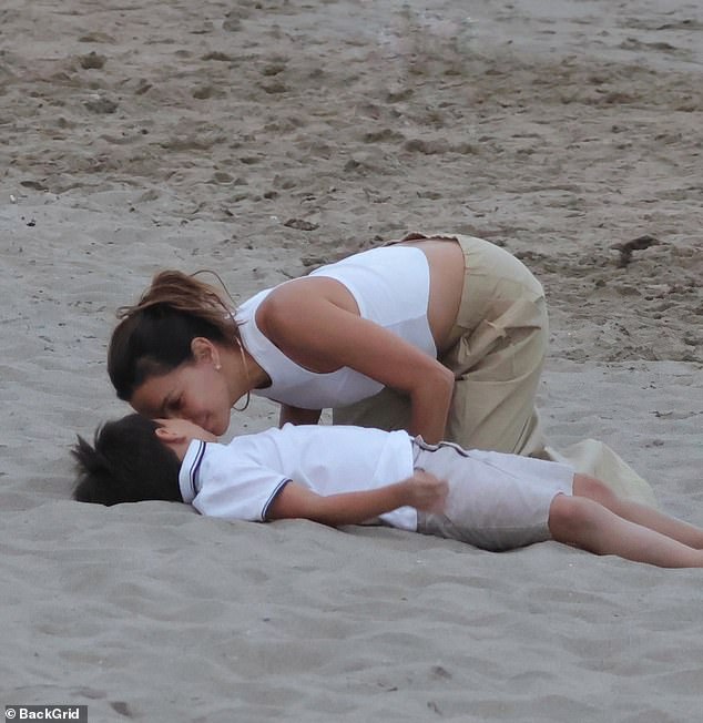 Eva Longoria looked every inch the doting mother as she spent quality time with her son, Santiago Enrique Bastón, during a beach outing in Marbella on Monday