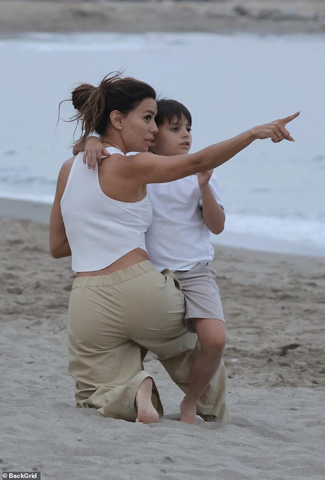 The American actress, 50, cut a laid-back figure in a white crop top as she and her family enjoyed some downtime to mark Saint John's Eve (Noche de San Juan)