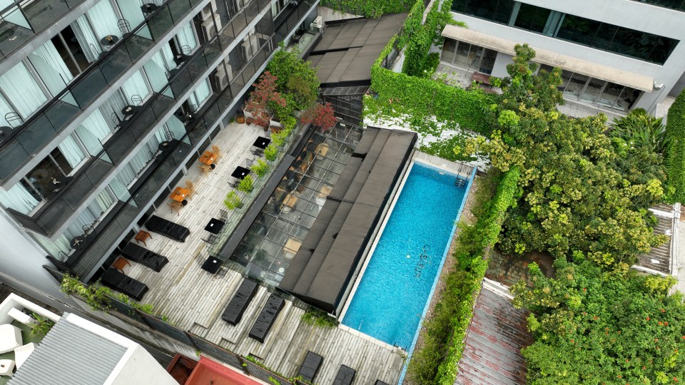 Aerial view of a hotel pool and patio.