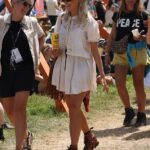 Holly Willoughby got into the festival spirit as she milled around Glastonbury with a drink in hand on Friday