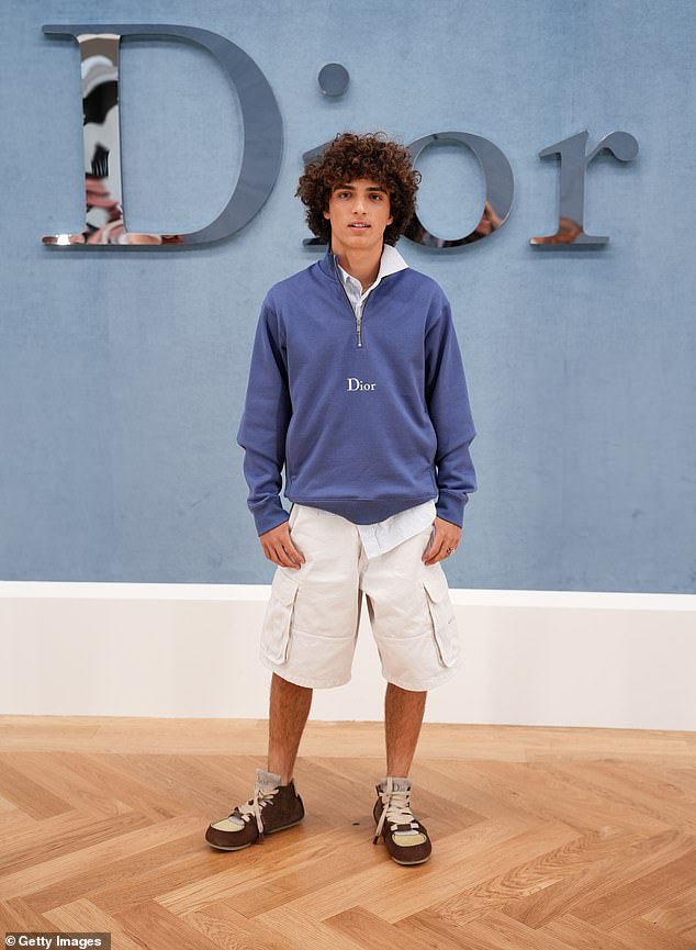 With his hands casually tucked in his pockets, fashion-forward boots on his feet, and modeling clearly in his DNA—thanks to his Brazilian supermodel mom—the teen exuded effortless cool