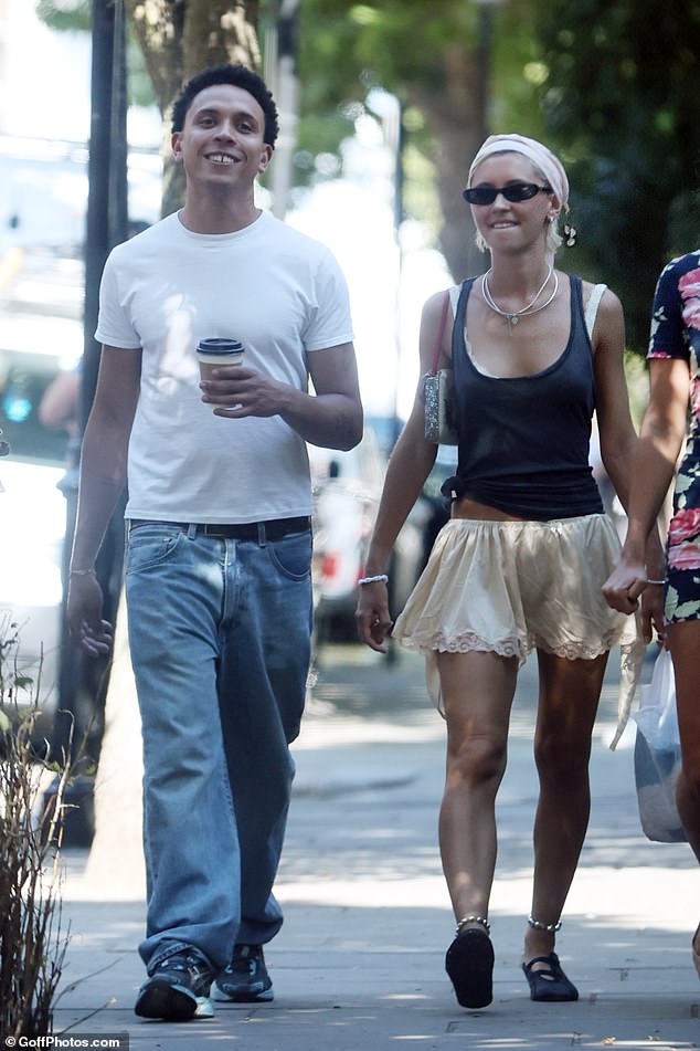 Iris Law sparked romance rumours as she enjoyed a stroll through Notting Hill with DJ Tommy Gold last week