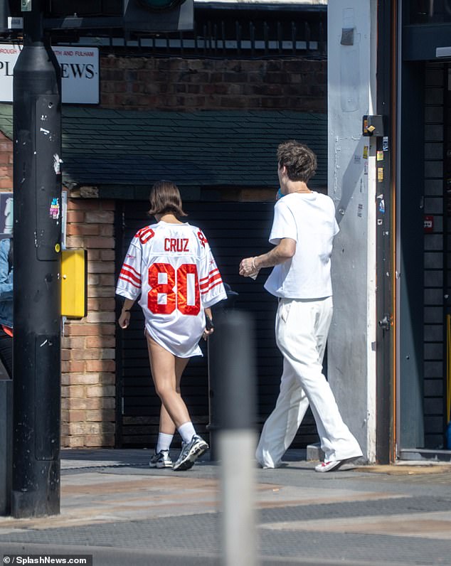 Jackie Apostel has shown her support for her boyfriend Cruz Beckham by wearing a football jersey with his name on it