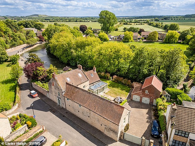 Rowland Bridge House in the historic market town of Tickhill, in Doncaster, South Yorkshire, features five bedrooms, three bathrooms, four reception rooms, and a 'large living kitchen'