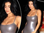Kylie Jenner squeezes her surgically-enhanced cleavage into silver dress after shock boob job admission