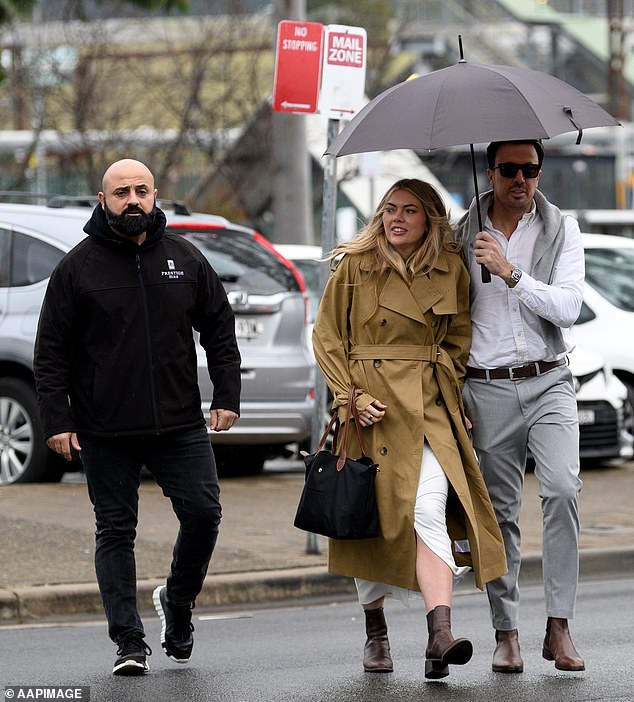 Jacqui Burfoot and Clint Rice arrived at Sydney's Campbelltown Local Court on Tuesday with a bodyguard for the AVO hearing