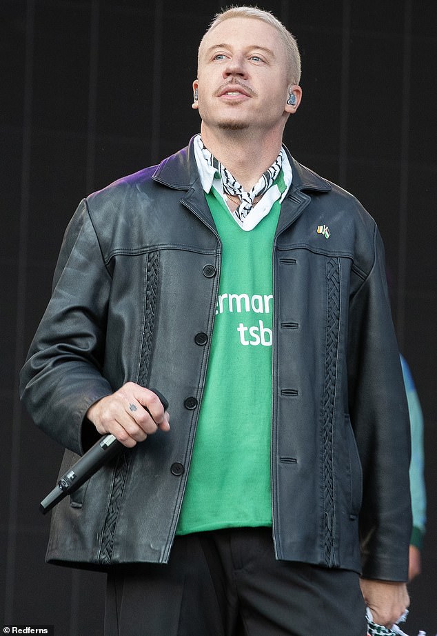 Macklemore's house was broken into by two masked burglars who are accused of stealing thousands of dollars' worth of his belongings; the rapper is pictured last week in Dublin