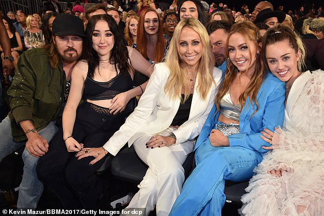 She told Lewinsky that at one point of the 'dark decade,' half of her family members were not speaking to each other (pictured L-R dad Billy Ray Cyrus, sister Noah, mum Tish, sister Brandi, and Miley)