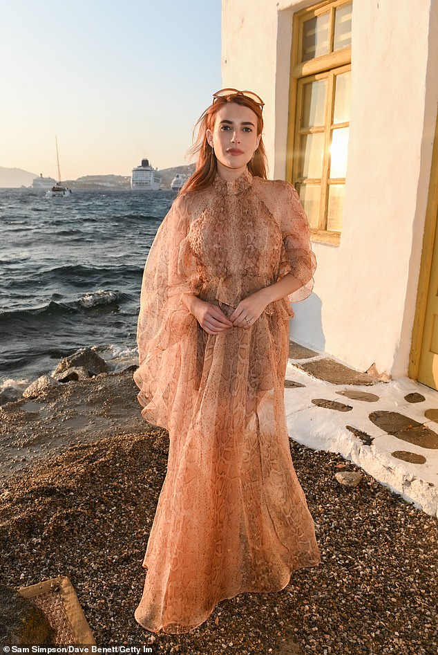 Emma looked sensational in a nude sheer dress which featured a wild snake print design. She paired her ethereal garment with a pair of modest nude open-toe heels