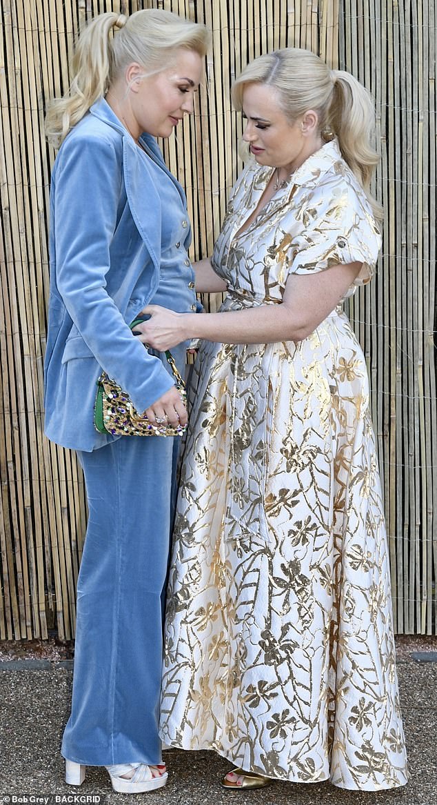 At the star-studded shindig, the Pitch Perfect star, 45, melted hearts as she was spotted fixing her spouse's waistcoat