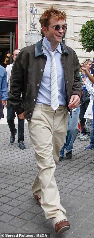 Robert Pattison was all smiles as he left his hotel for the show
