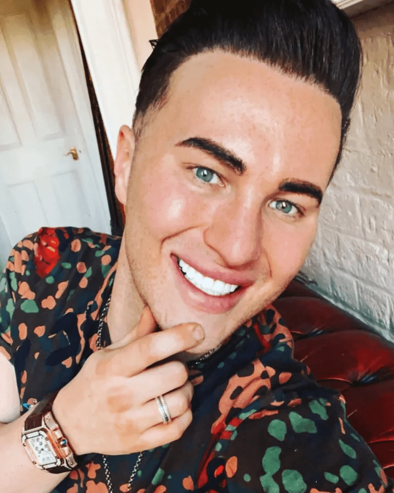 Close-up selfie of a man smiling.