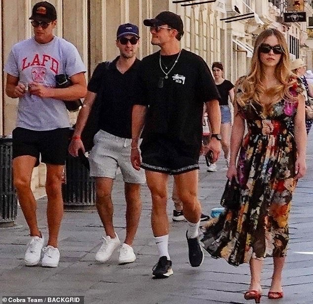 Tom Brady (left) is seen enjoying a morning walk in Venice Saturday with Orlando Bloom (second from right) and Sydney Sweeney (right) after Jeff Bezos' wedding to Lauren Sanchez
