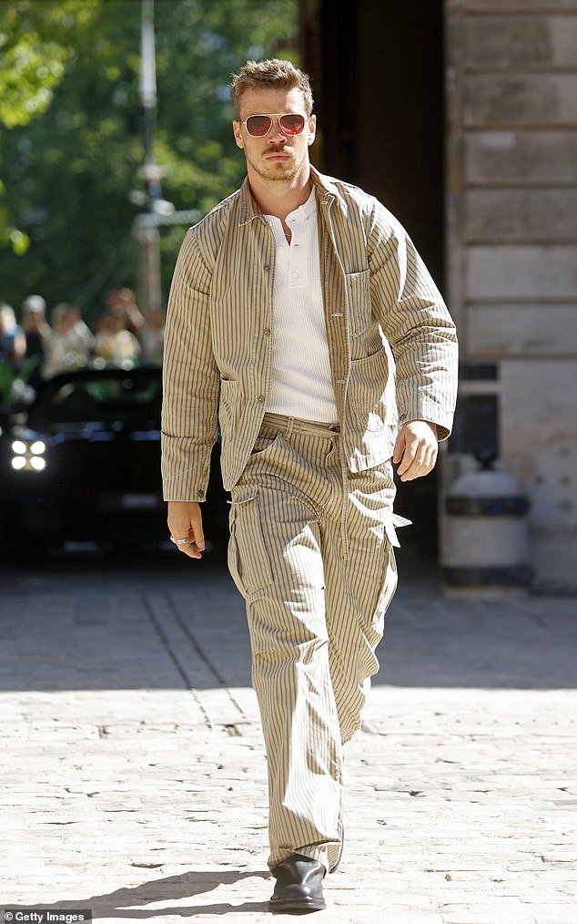 He took to the catwalk in a pair of chunky black shoes
