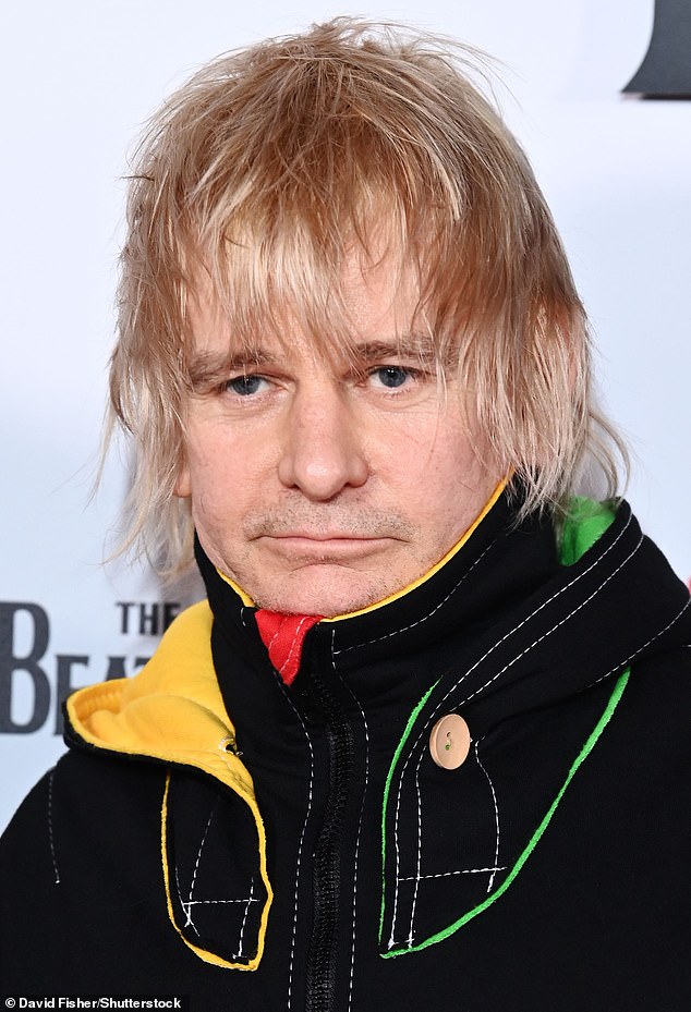 The ex-Oasis drummer - who was recently sacked from The Who - said he struggled to get the approval from his father when performing in front of him (pictured in 2021)