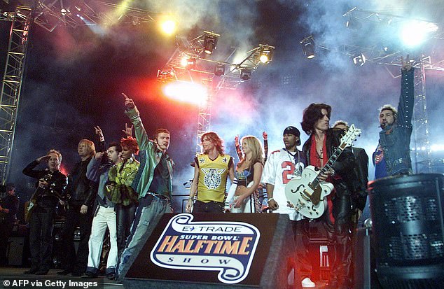 Aerosmith performed the Super Bowl halftime show in 2001 along with Britney Spears, boyband NSYNC, and rapper Nelly (pictured) and were inducted into the Rock N Roll Hall of Fame that year