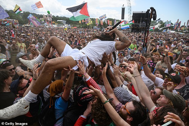 Bobby Vylan of Bob Vylan crowdsurfs in front of the West Holts stage during day four of the Glastonbury Festival 2025 at Worthy Farm, Pilton in Somerset, on Saturday