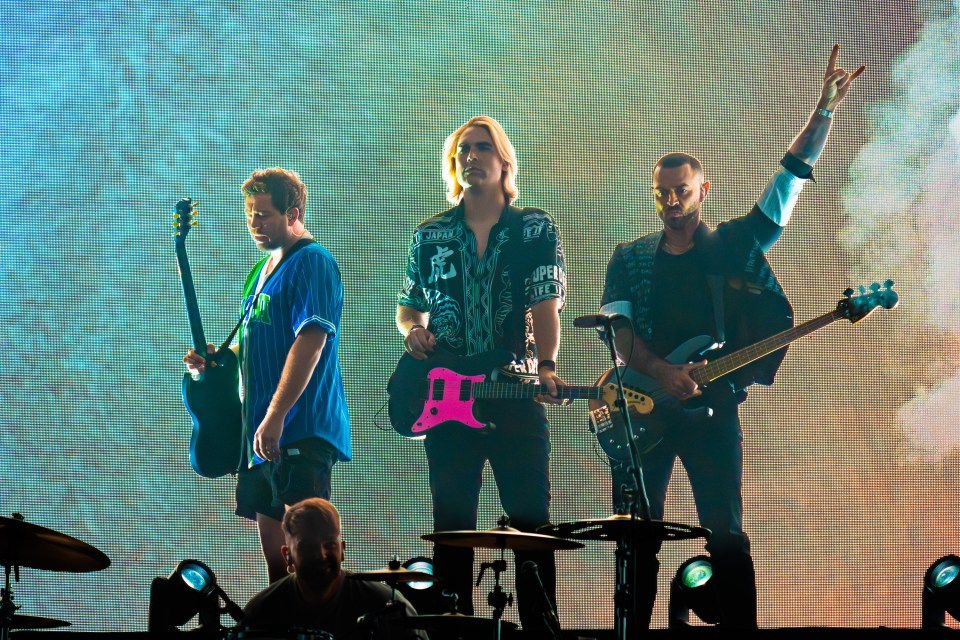 Busted performing on stage.