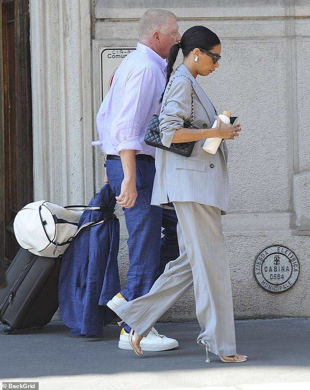Boris - who already has four children by three women - cut a dapper figure in a lilac shirt and blue jeans, which he styled with white trainers