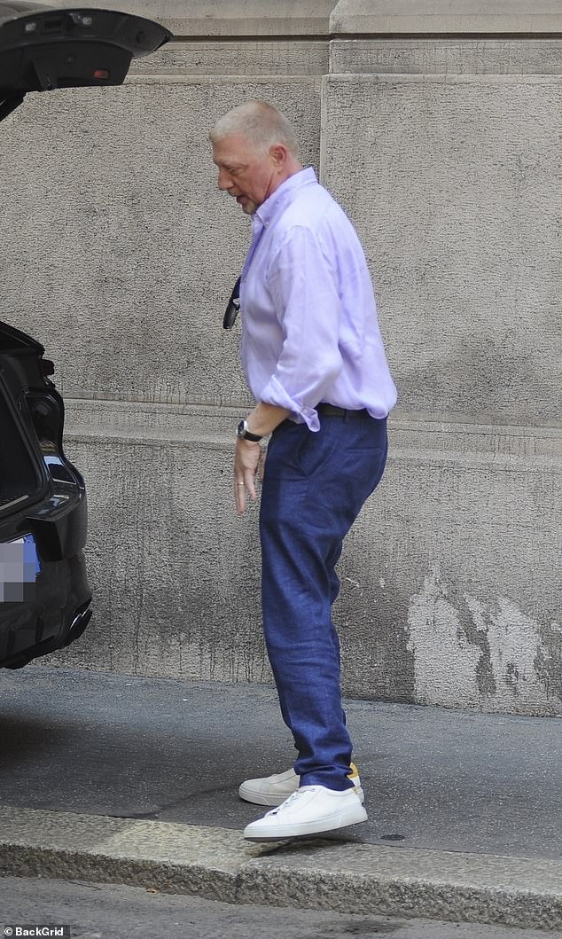 Boris fixed a pair of sunglasses in his shirt and sported a silver watch to complete his suave look