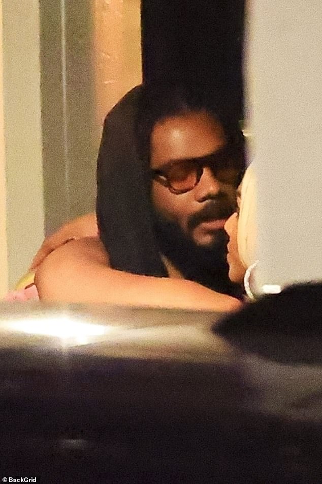 The couple, who met in 2016, looked in love as they piled on the PDA
