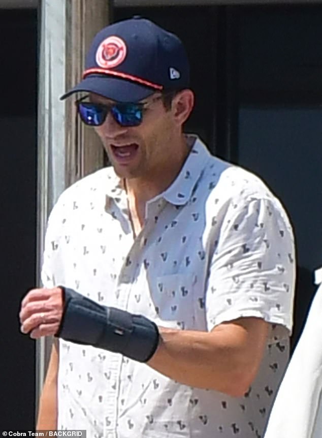 Ashton's (born Christopher) wrist guard could be a result of injury, carpal tunnel syndrome, or his autoimmune condition vasculitis - which he said he 'fully recovered' from in 2022