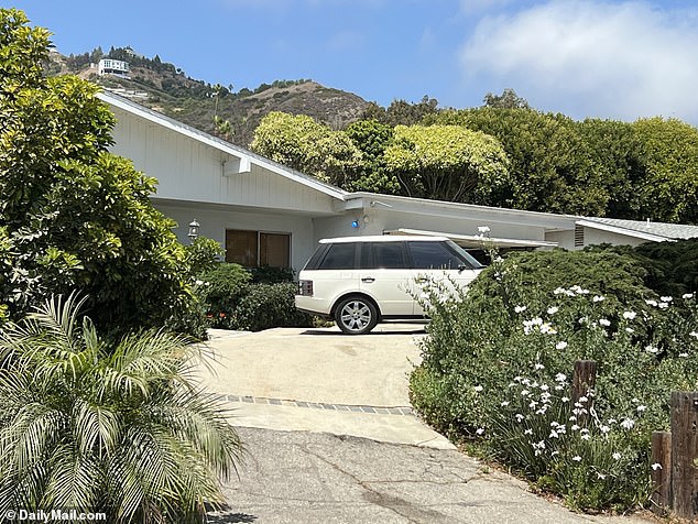 A white Range Rover was also pictured in the driveway on Thursday