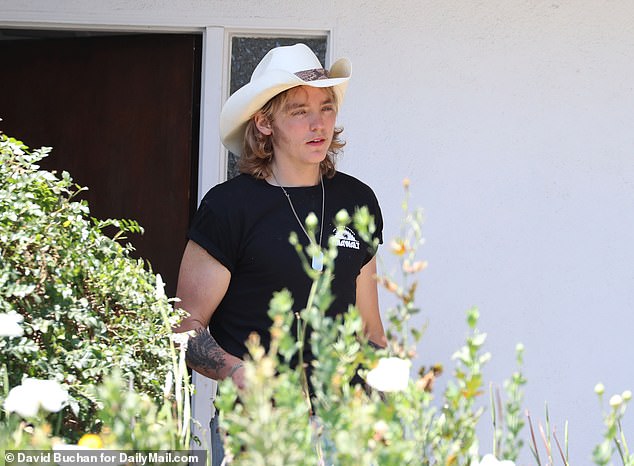 Luke, who is one of three sons Madsen and ex DeAnna share, was seen wearing a cowboy hat as he exited the home