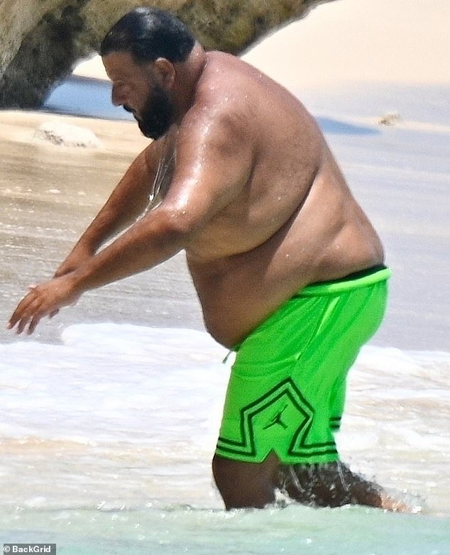 He enjoyed a solo stroll on the sand, unaccompanied by his wife of eight years Nicole Tuck or their two sons Asahd, eight, and Aalam, five